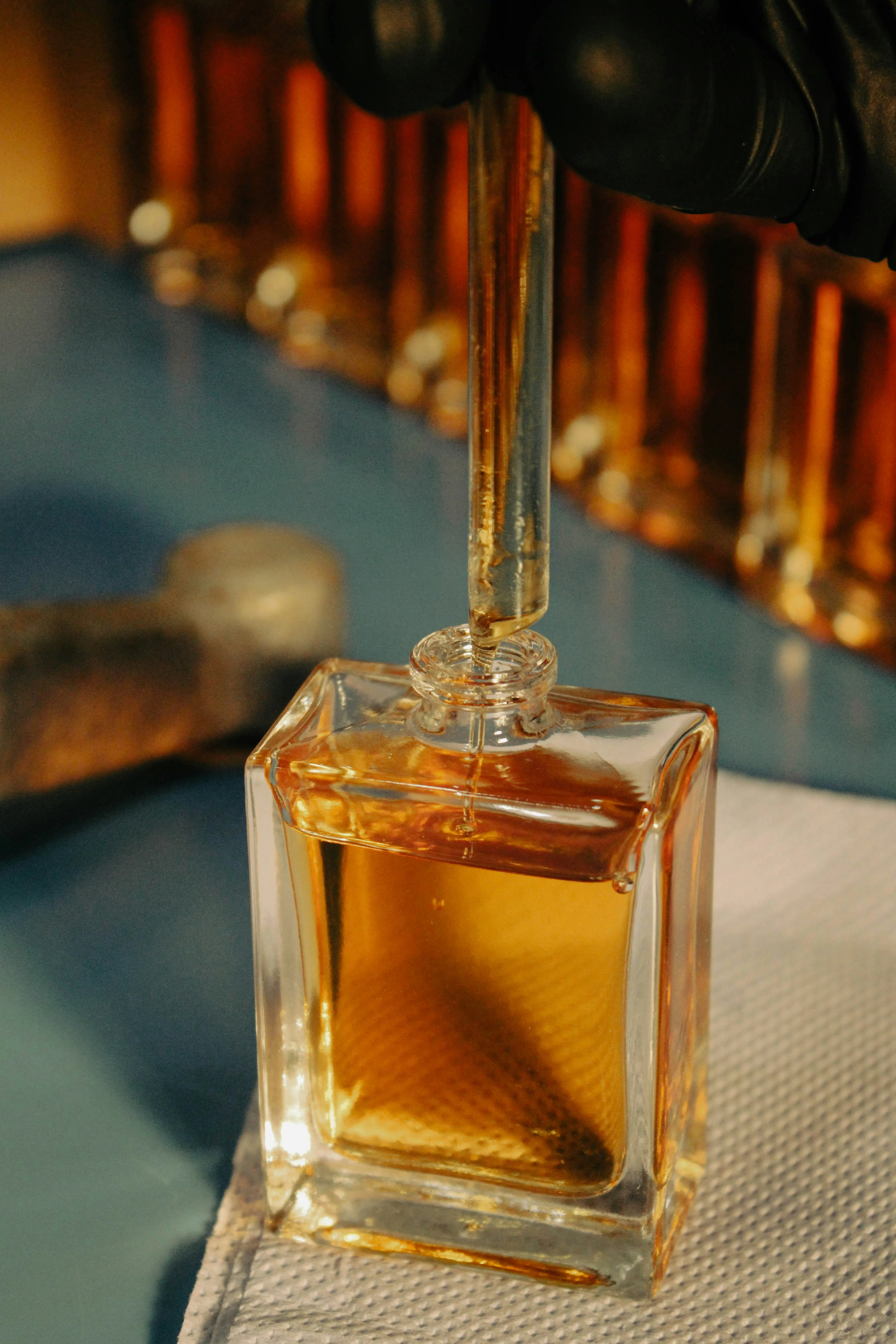 Aesthetic unbranded fragrance bottles in a clean studio setting